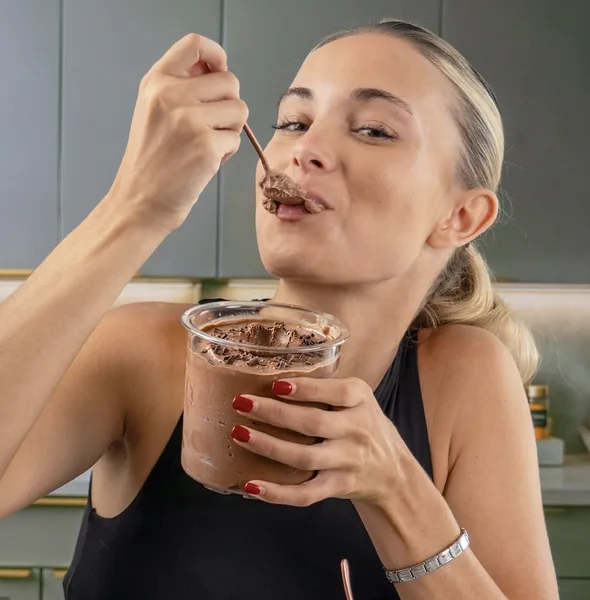 Woman getting creative with protein pudding recipes
