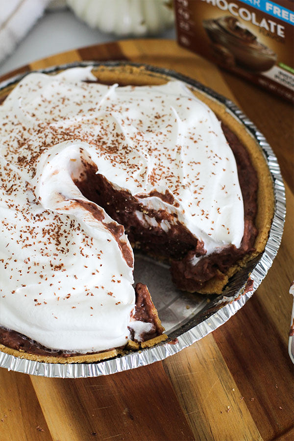 Top view of chocolate silk pie with whipped topping in a pie crust