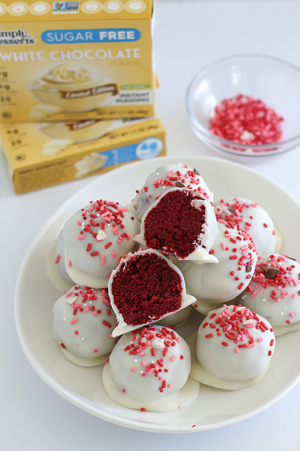 Sugar free red velvet cake pop balls coated in white chocolate on a serving plate